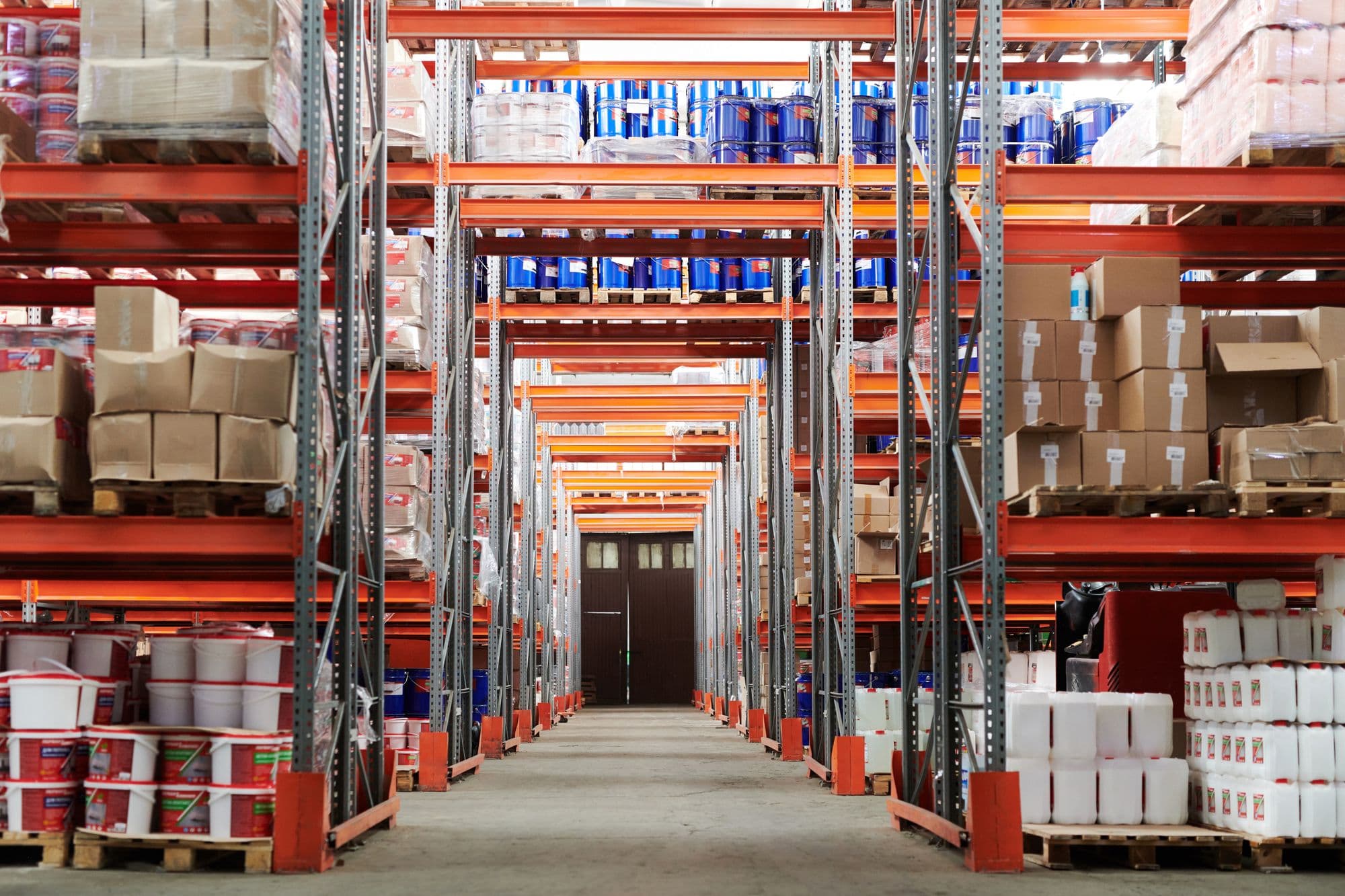 Warehouse aisle with pallet racking and stored materials